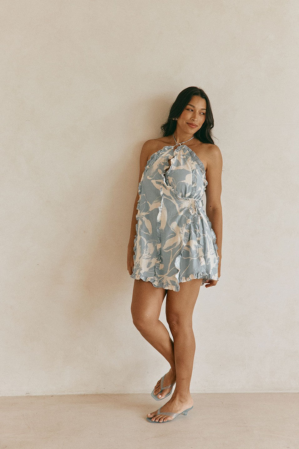 Blue mini dress with a halter neckline, back view
