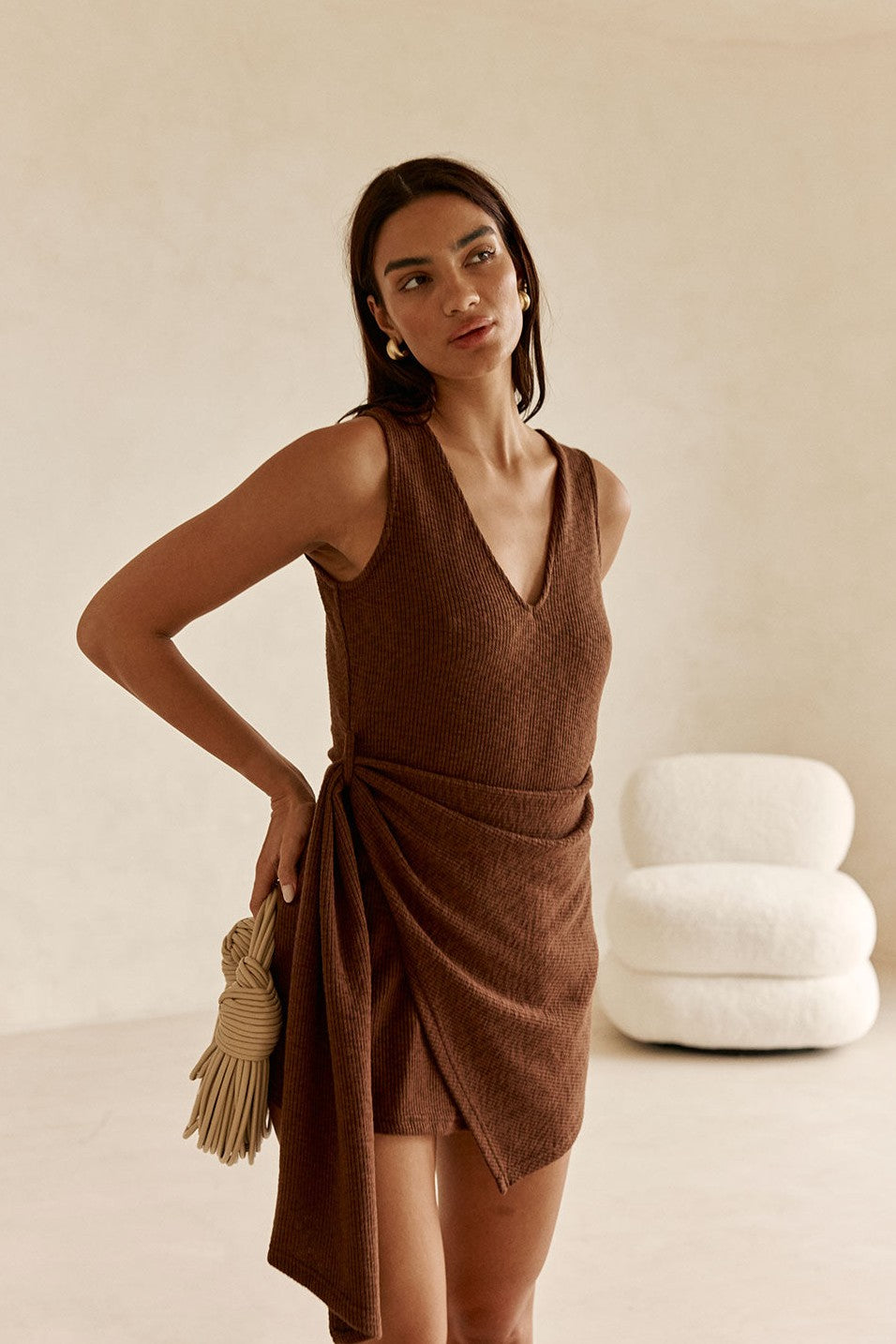 Brown mini dress with a V neckline, detail view