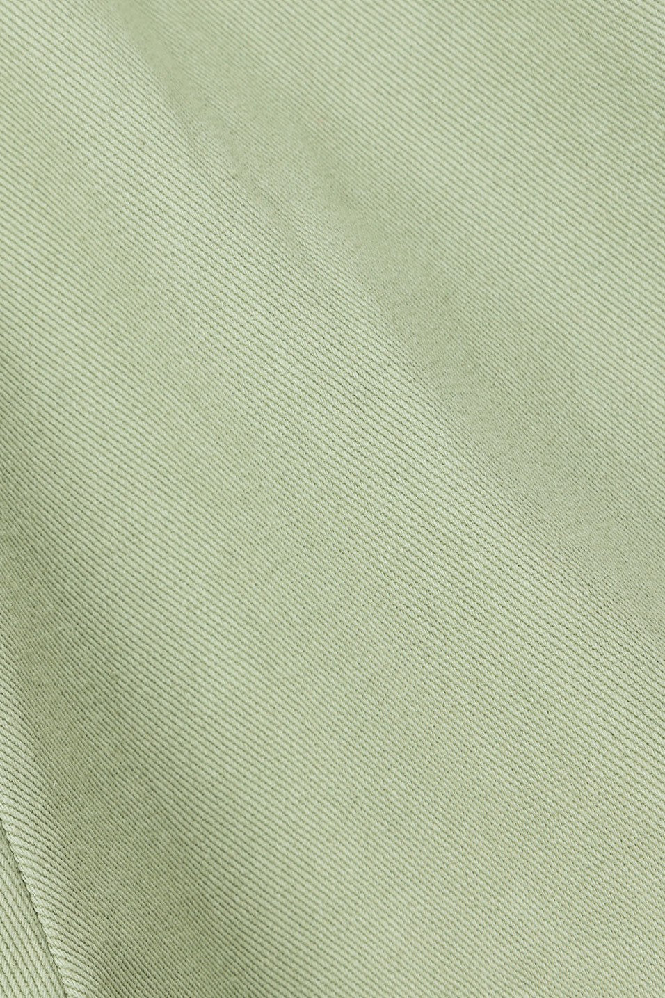 Green mini dress with an A-line skirt, detail view