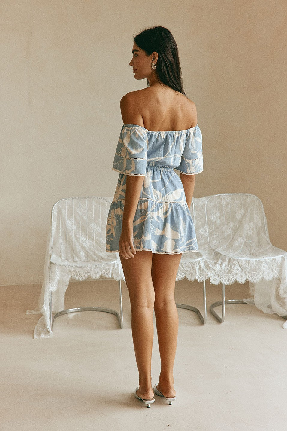 Blue mini dress with a drawstring waist, styled on model