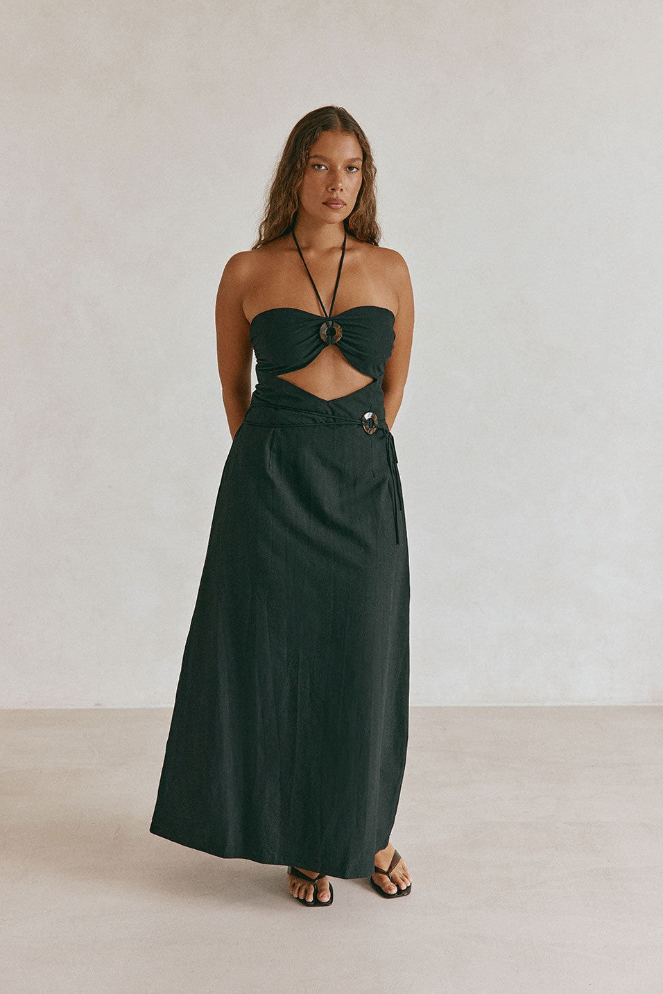 Black maxi dress with a strapless neckline, styled on model