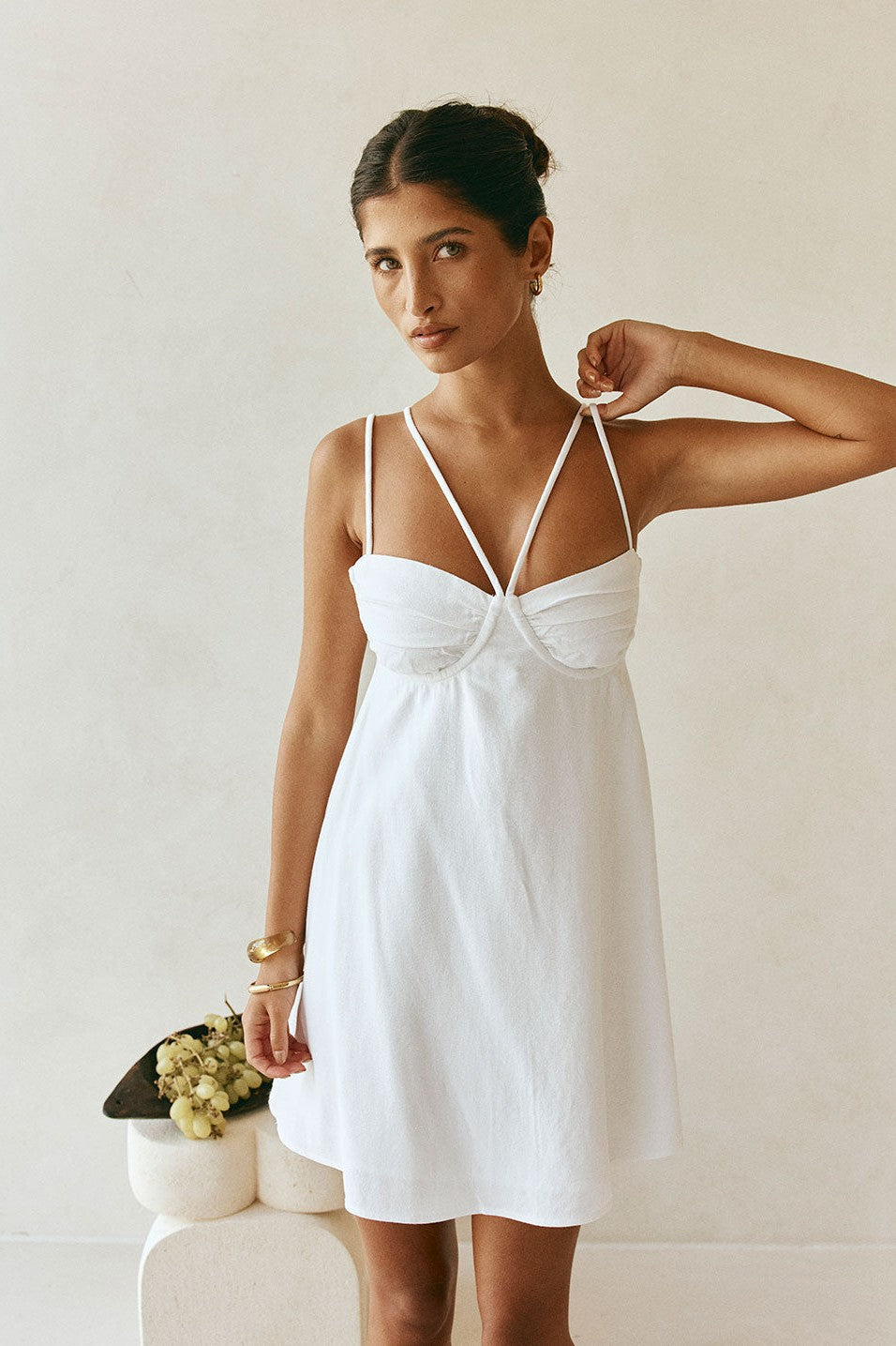 White mini dress with a round neckline, back view