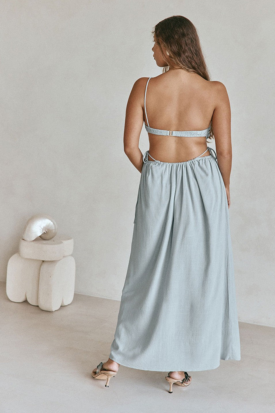 Blue maxi dress with an open back, detail view