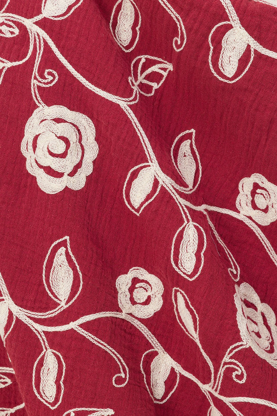 Red mini dress with slim tie straps, detail view