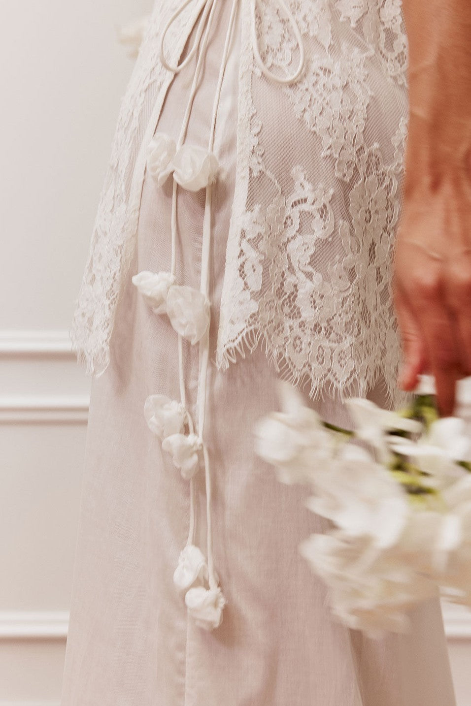 White maxi dress with a halter neckline, styled on model