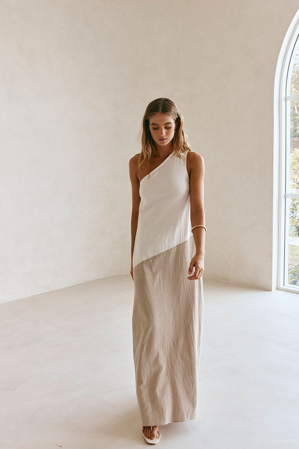 Beige maxi dress with an A-line skirt, side view