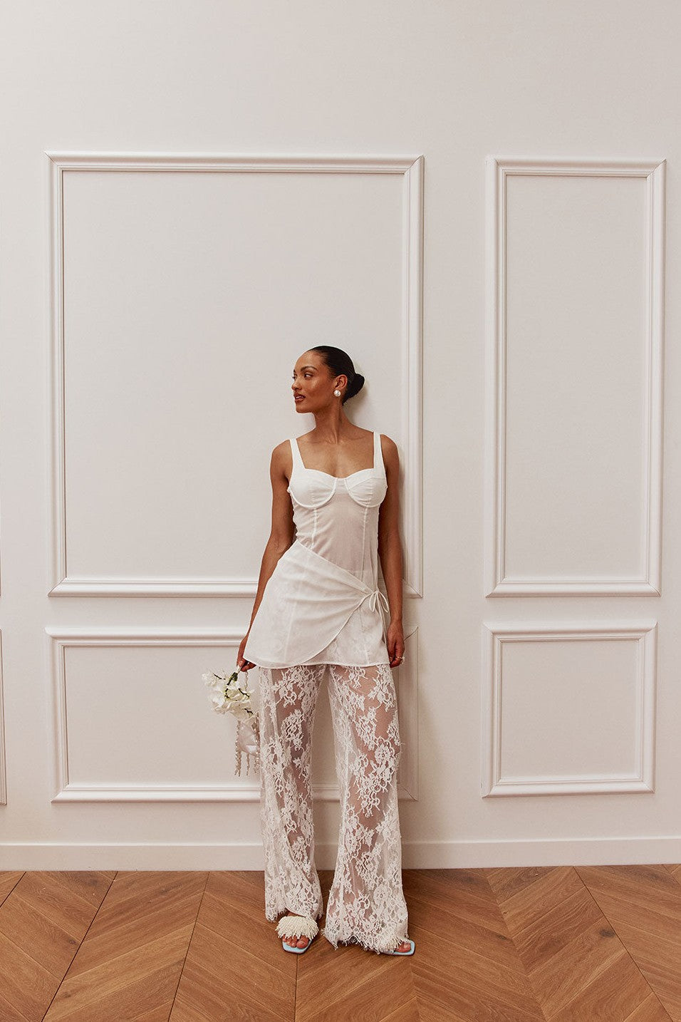 White midi dress with a wrap silhouette, side view