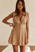 Cream mini dress with a plunging V neckline, front view