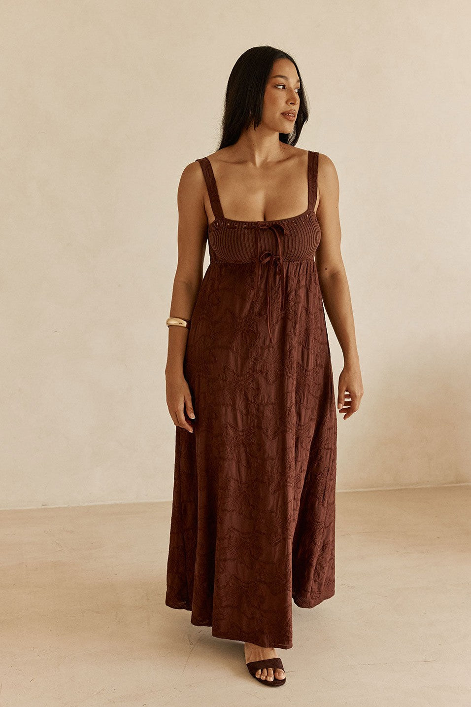 Brown maxi dress with an A-line skirt, back view