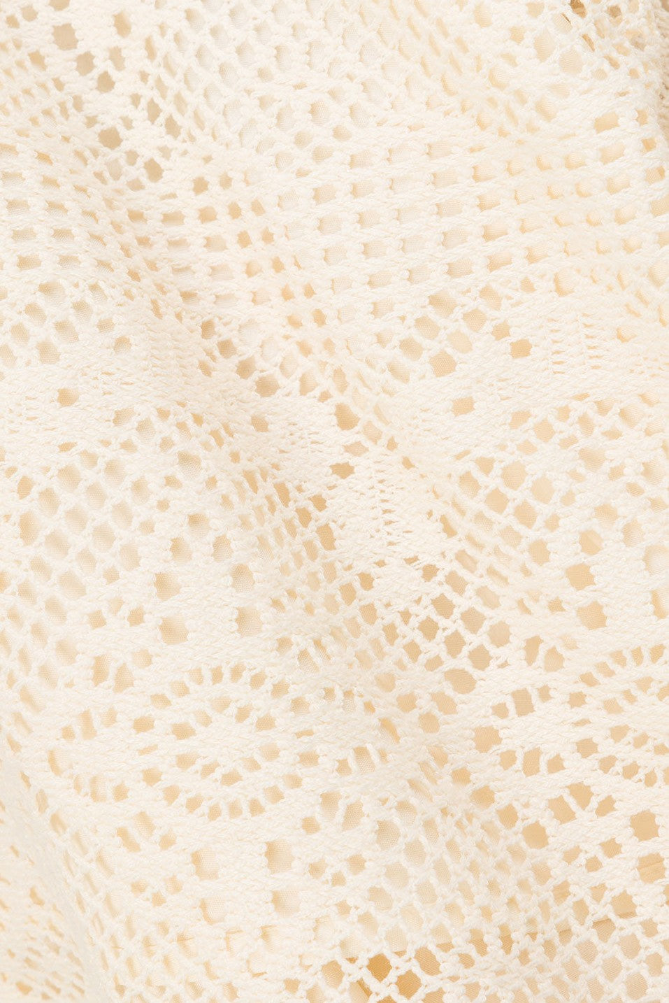 Beige mini dress with an A-line skirt, detail view