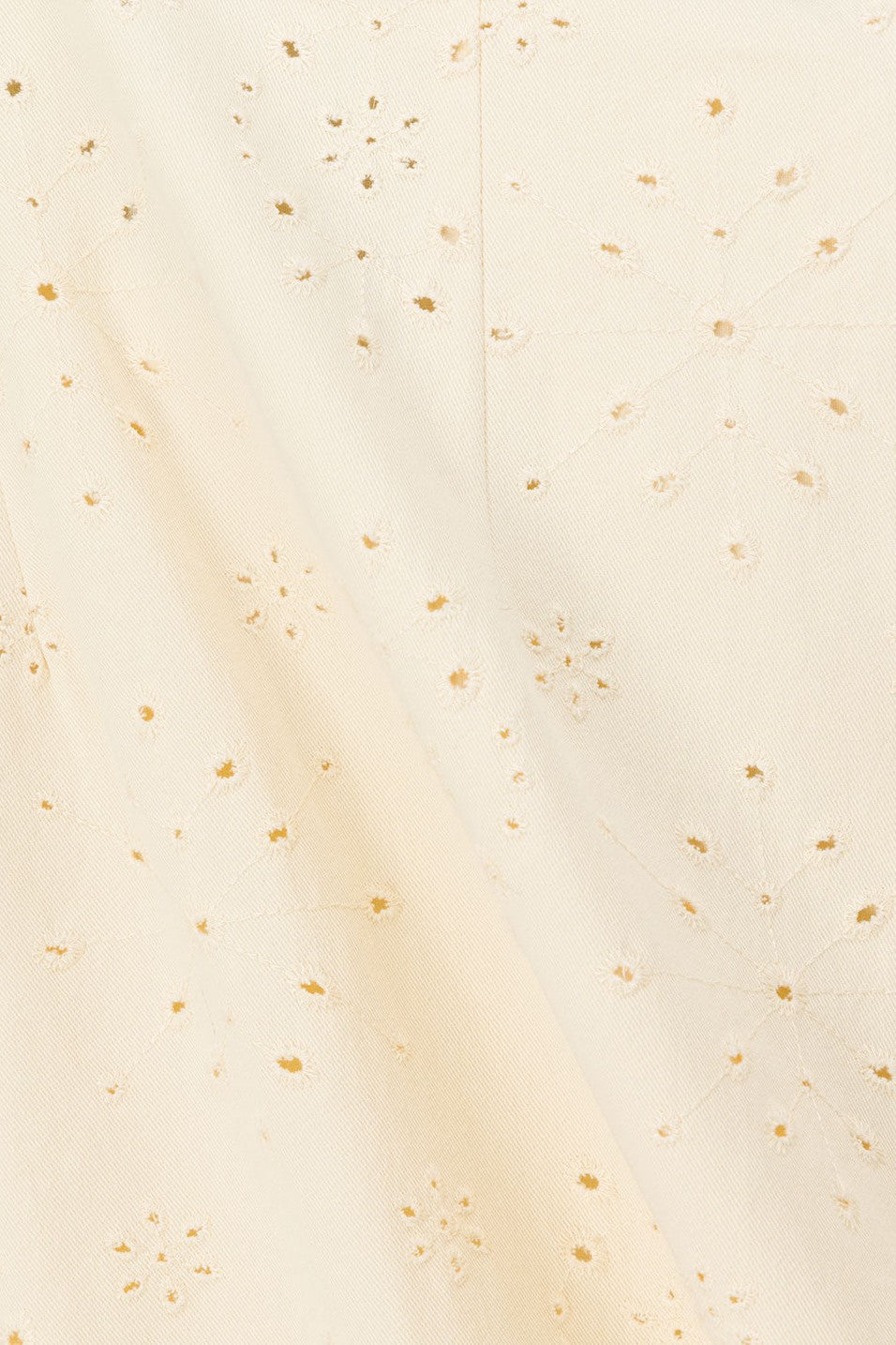 Cream mini dress with an A-line skirt, side view