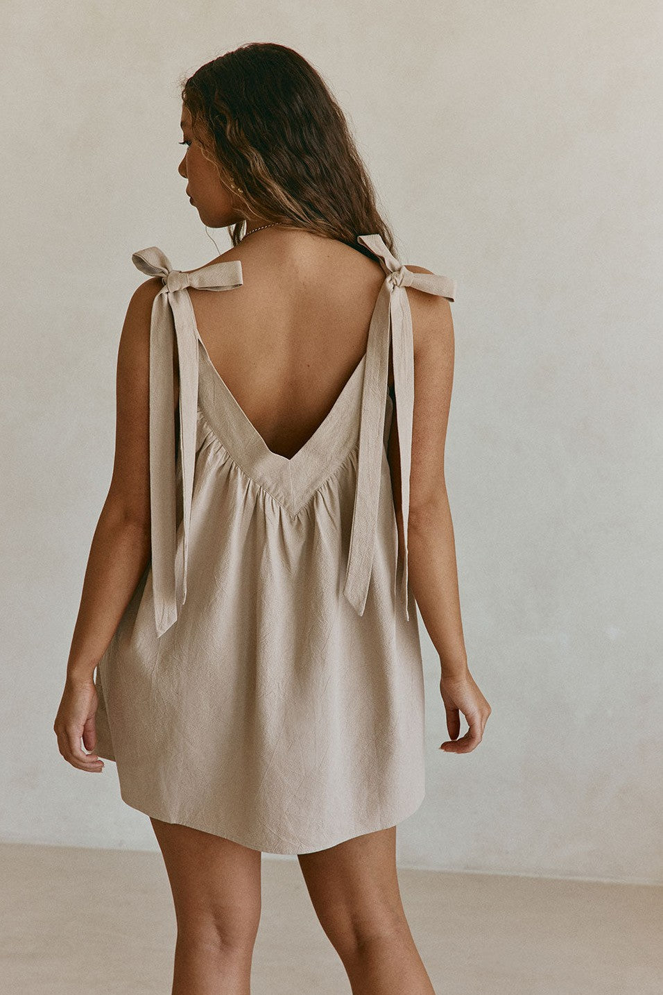 Beige mini dress, back view