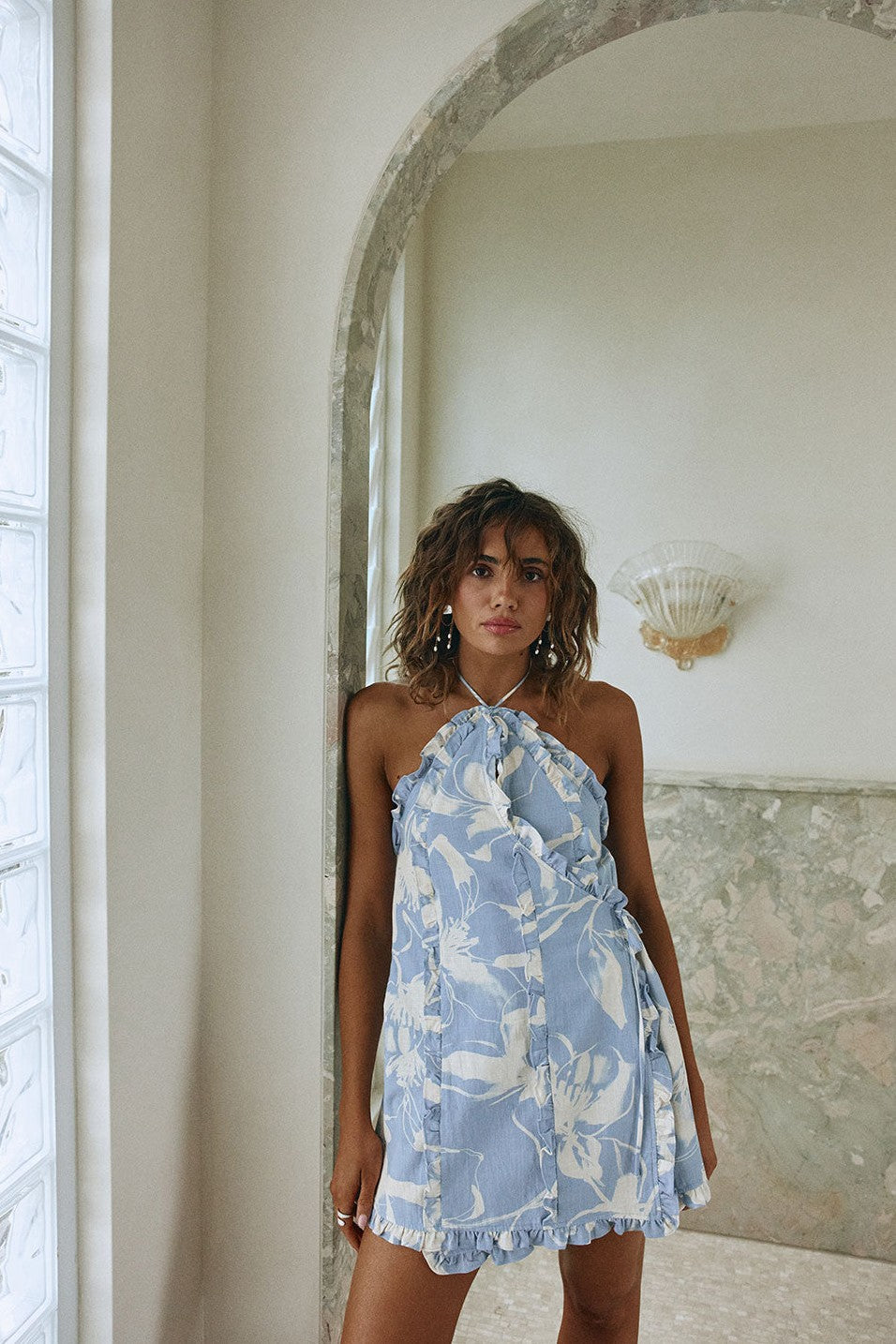 Blue mini dress with a halter neckline, back view