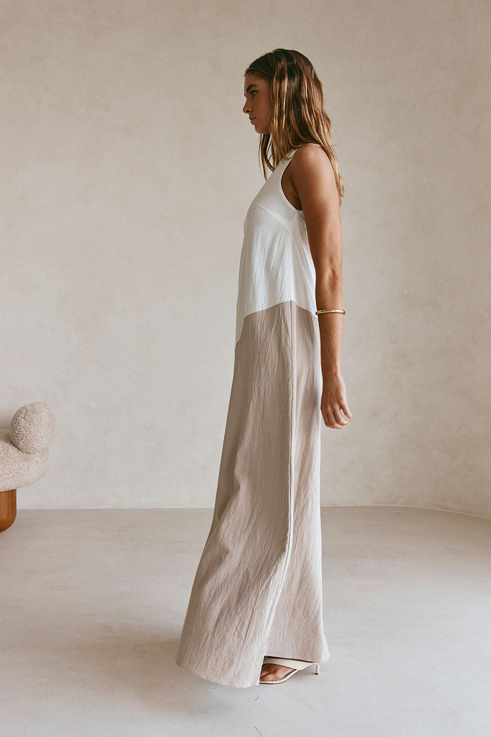 Beige maxi dress with an A-line skirt, detail view