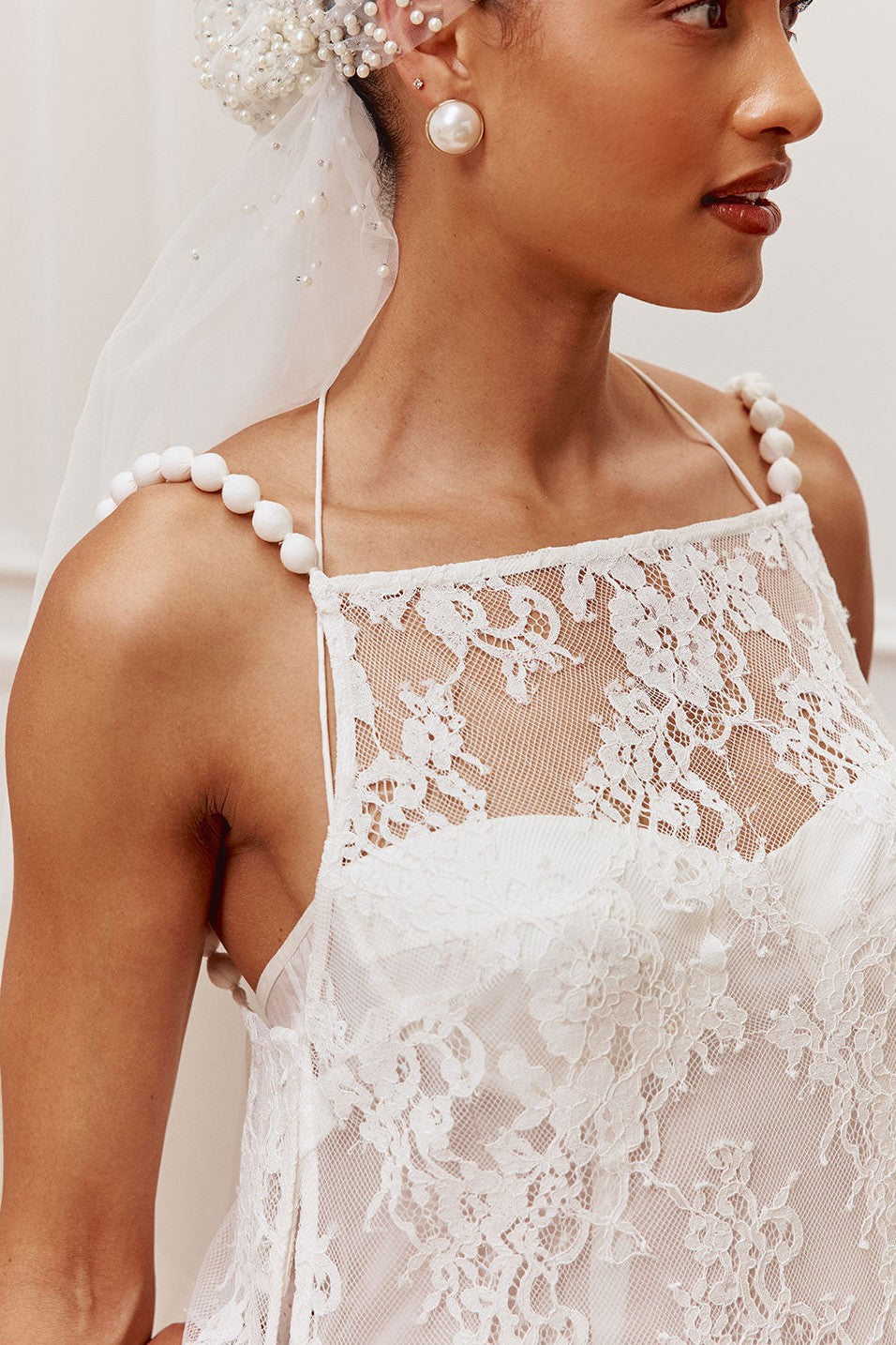 White maxi dress with a halter neckline, side view