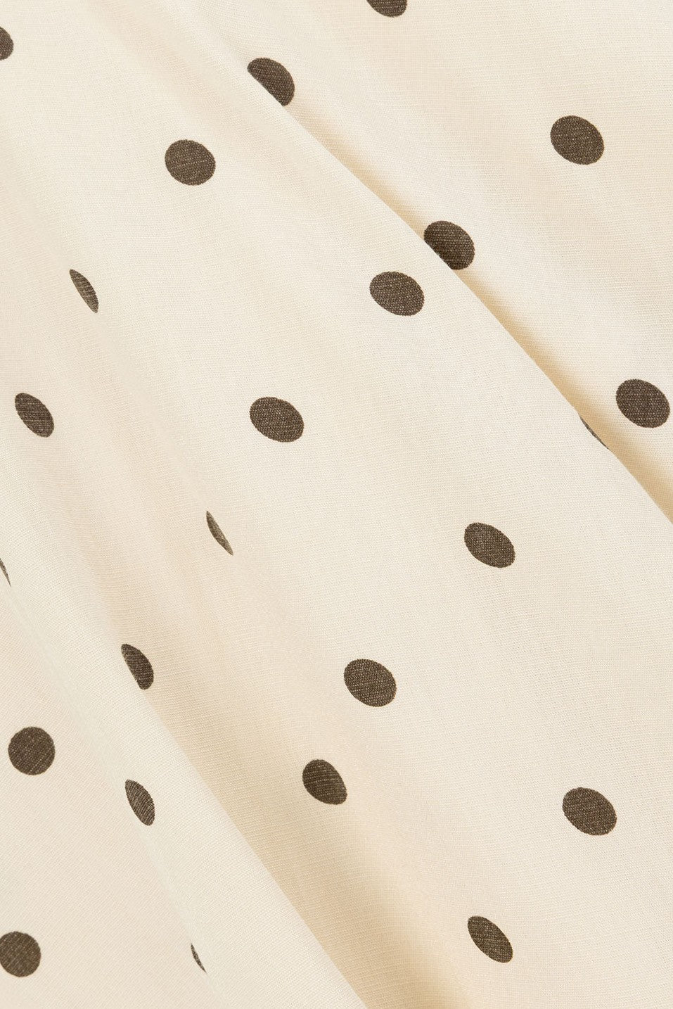 Cream maxi dress with a plunging V neckline, detail view