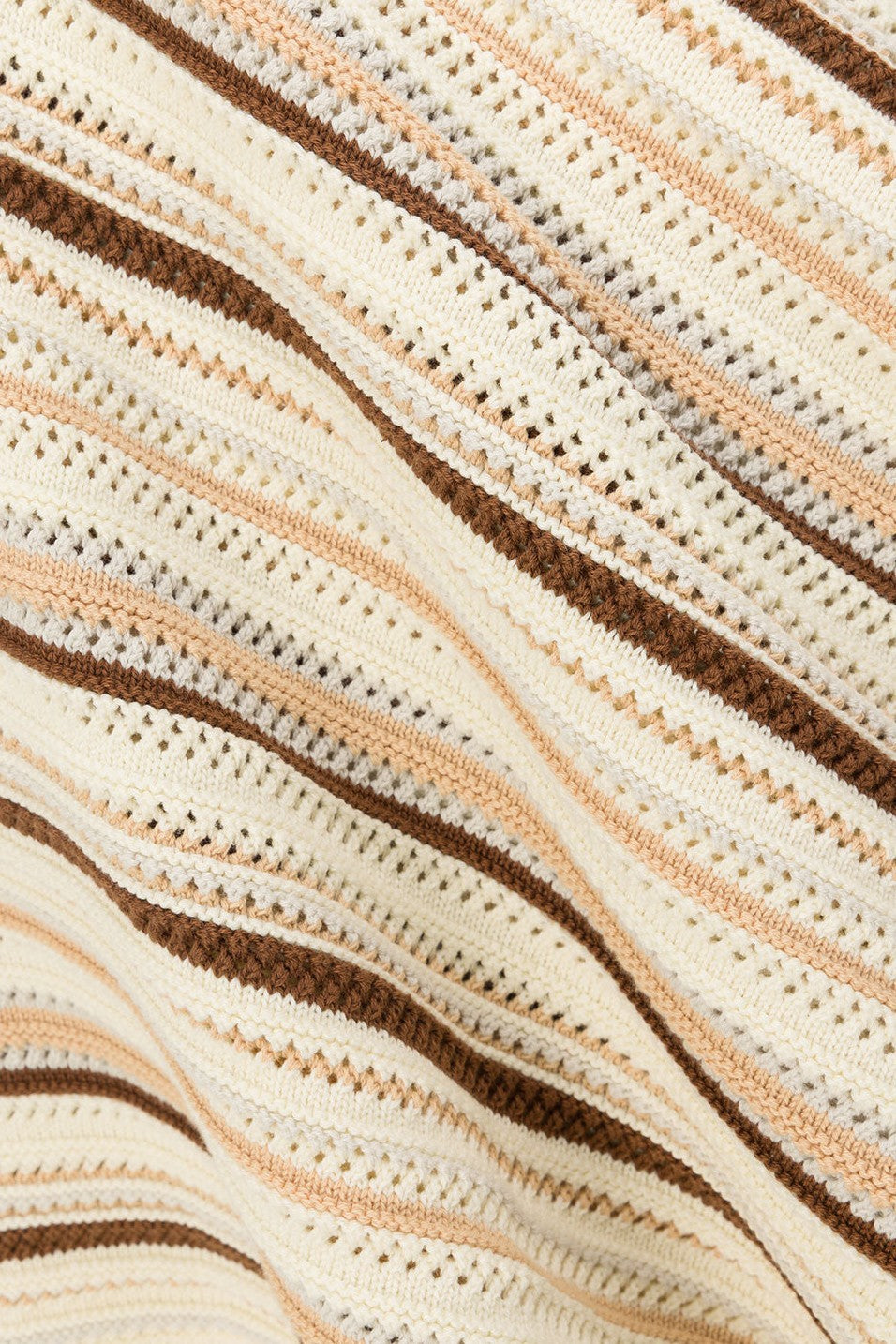 Cream maxi dress with a V neckline, side view