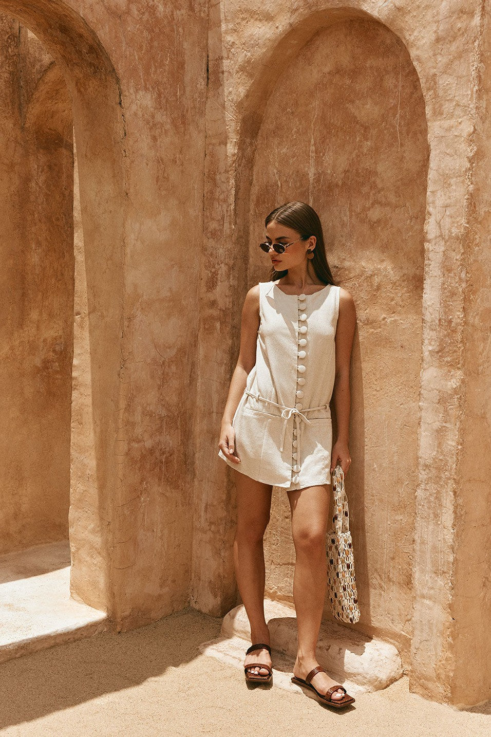 Beige mini dress with an A-line skirt, side view
