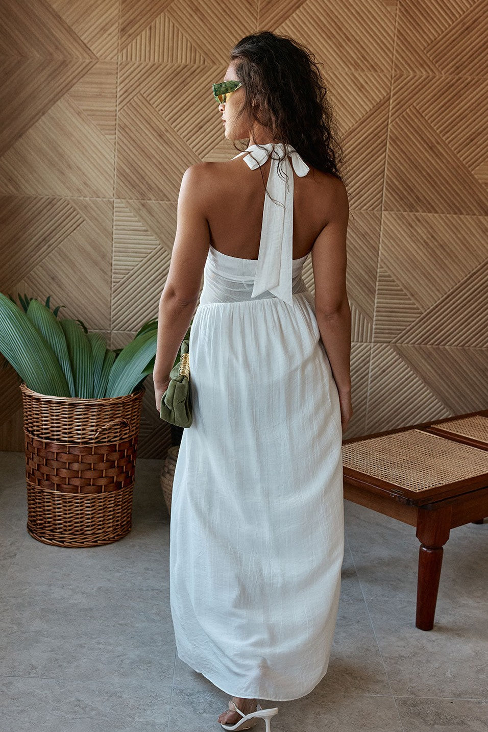 White maxi dress with a halter neckline, back view