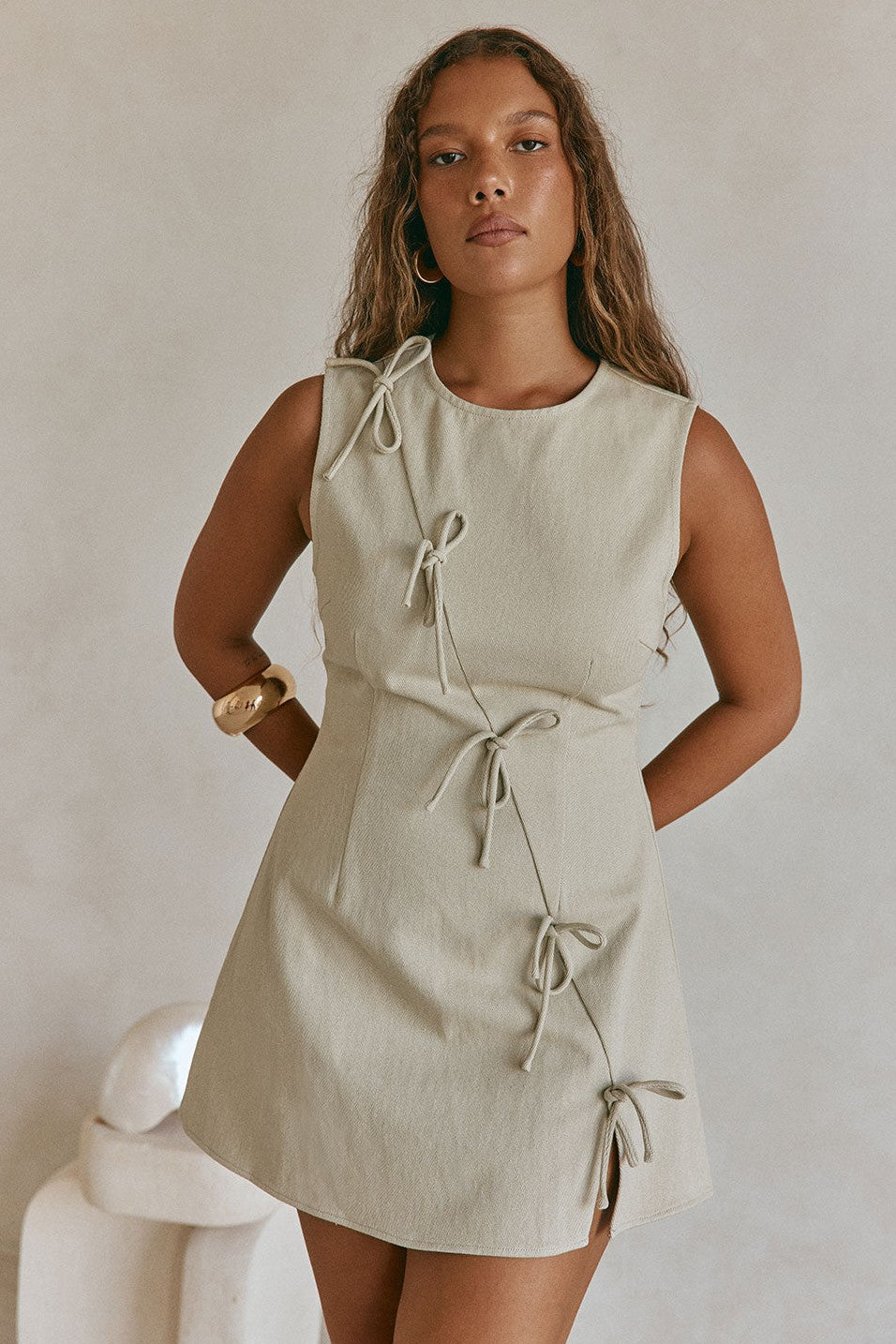 Green mini dress with an A-line skirt, side view