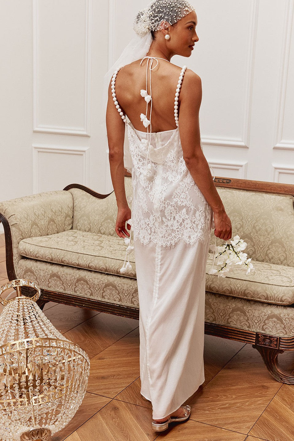White maxi dress with a halter neckline, side view