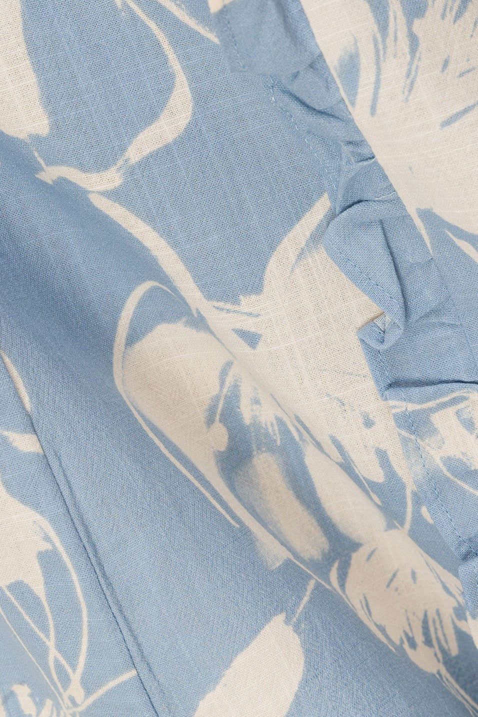 Blue mini dress with a halter neckline, detail view