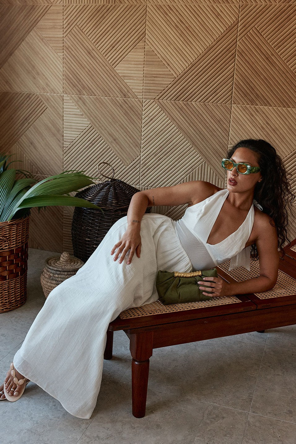 White maxi dress with a halter neckline, styled on model