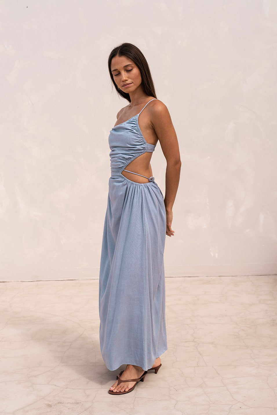 Blue maxi dress with an open back, front view