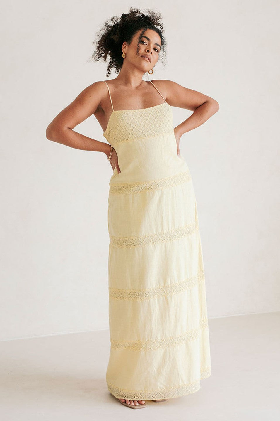 Yellow maxi dress with a round neckline, back view