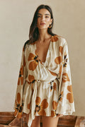 Orange mini dress with a wrap silhouette, front view