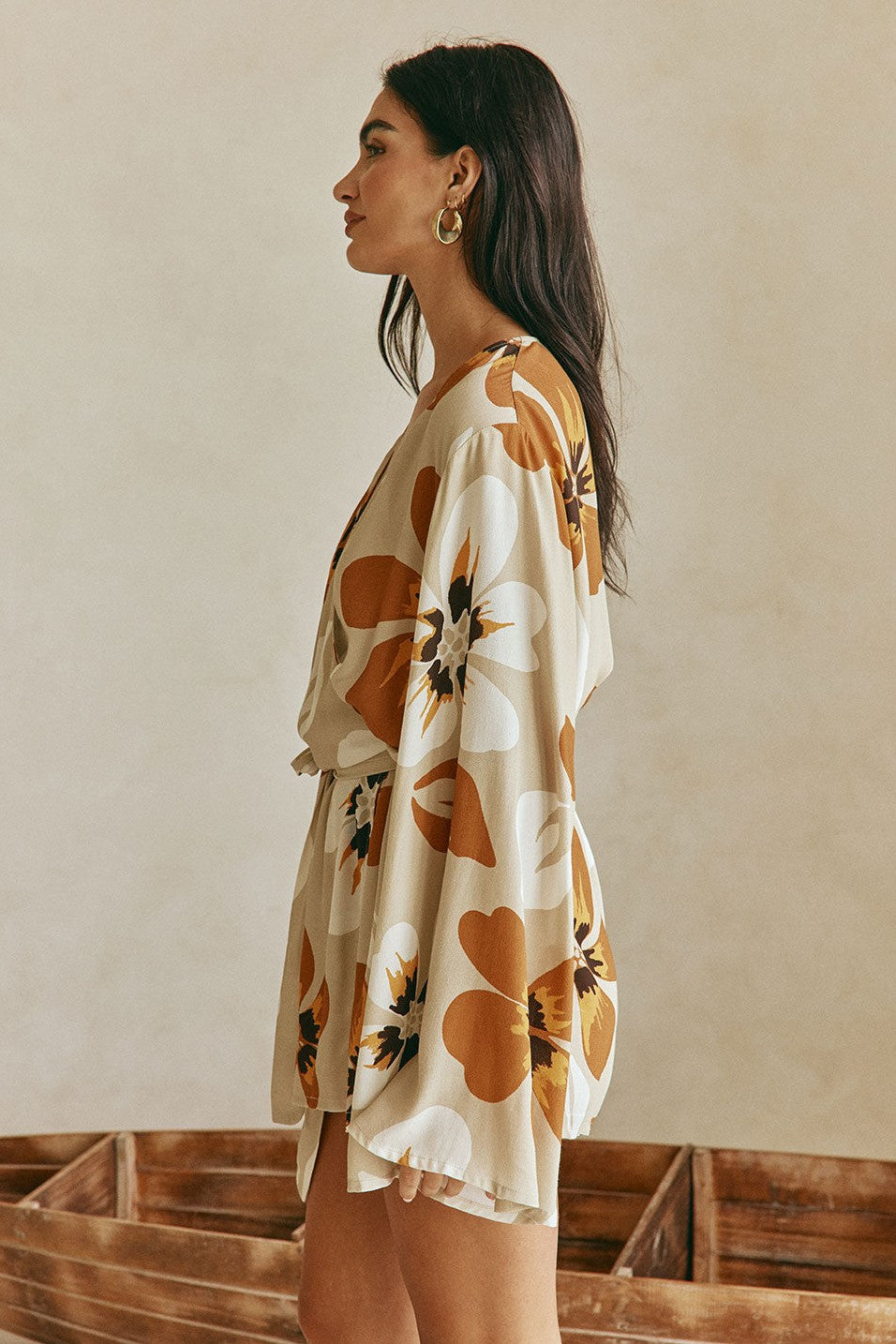 Orange mini dress with a wrap silhouette, styled on model