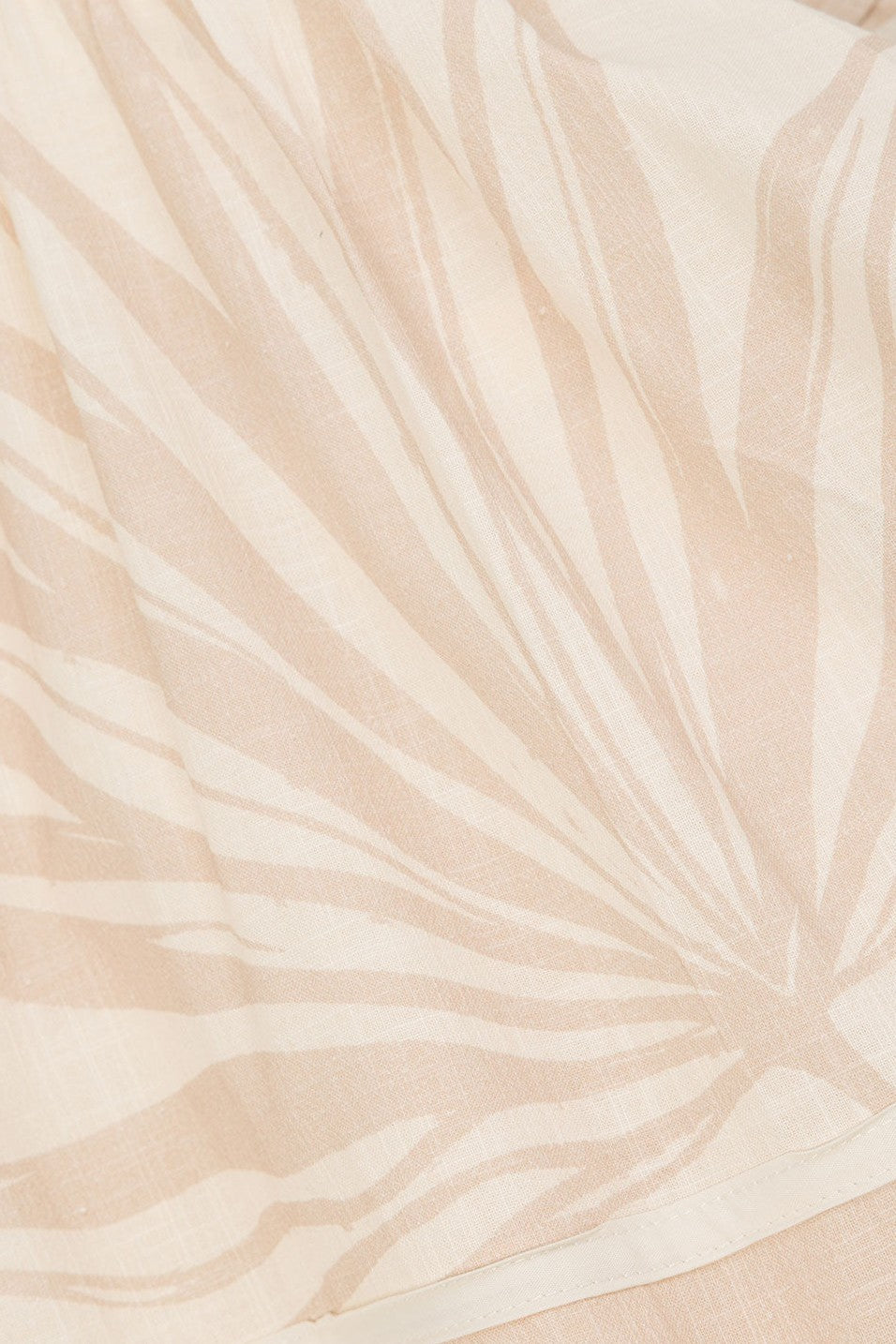 Beige mini dress with a side split, detail view