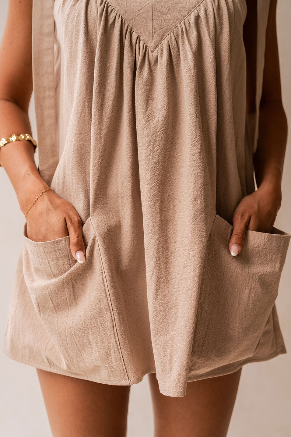 Beige mini dress, side view
