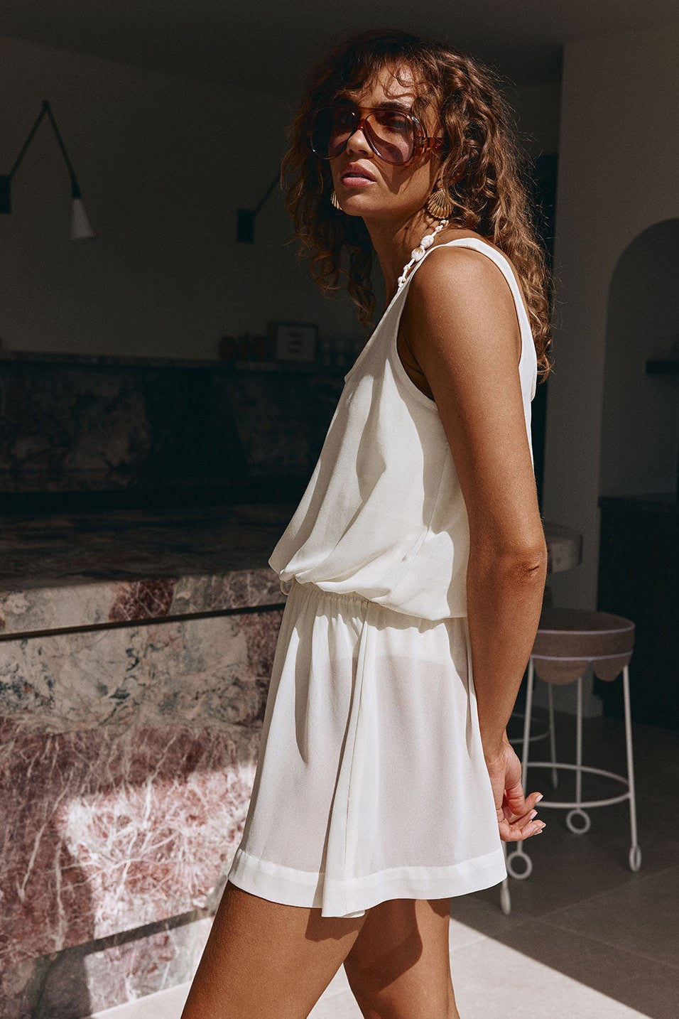 Beige mini dress with a halter neckline, front view