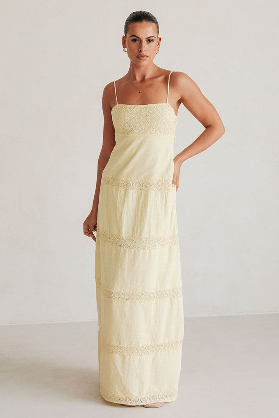 Yellow maxi dress with a round neckline, side view