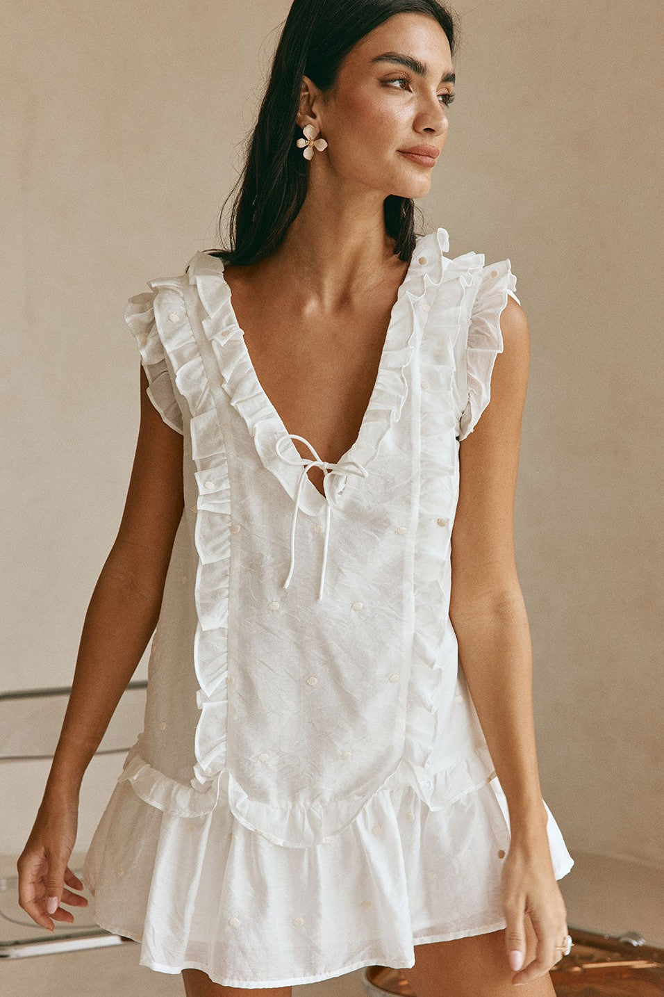 White mini dress with a V neckline, front view