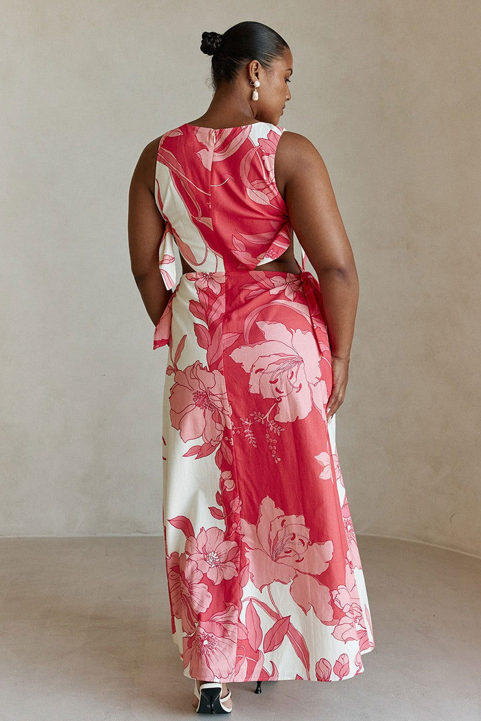 Pink maxi dress with a boat neckline, styled on model