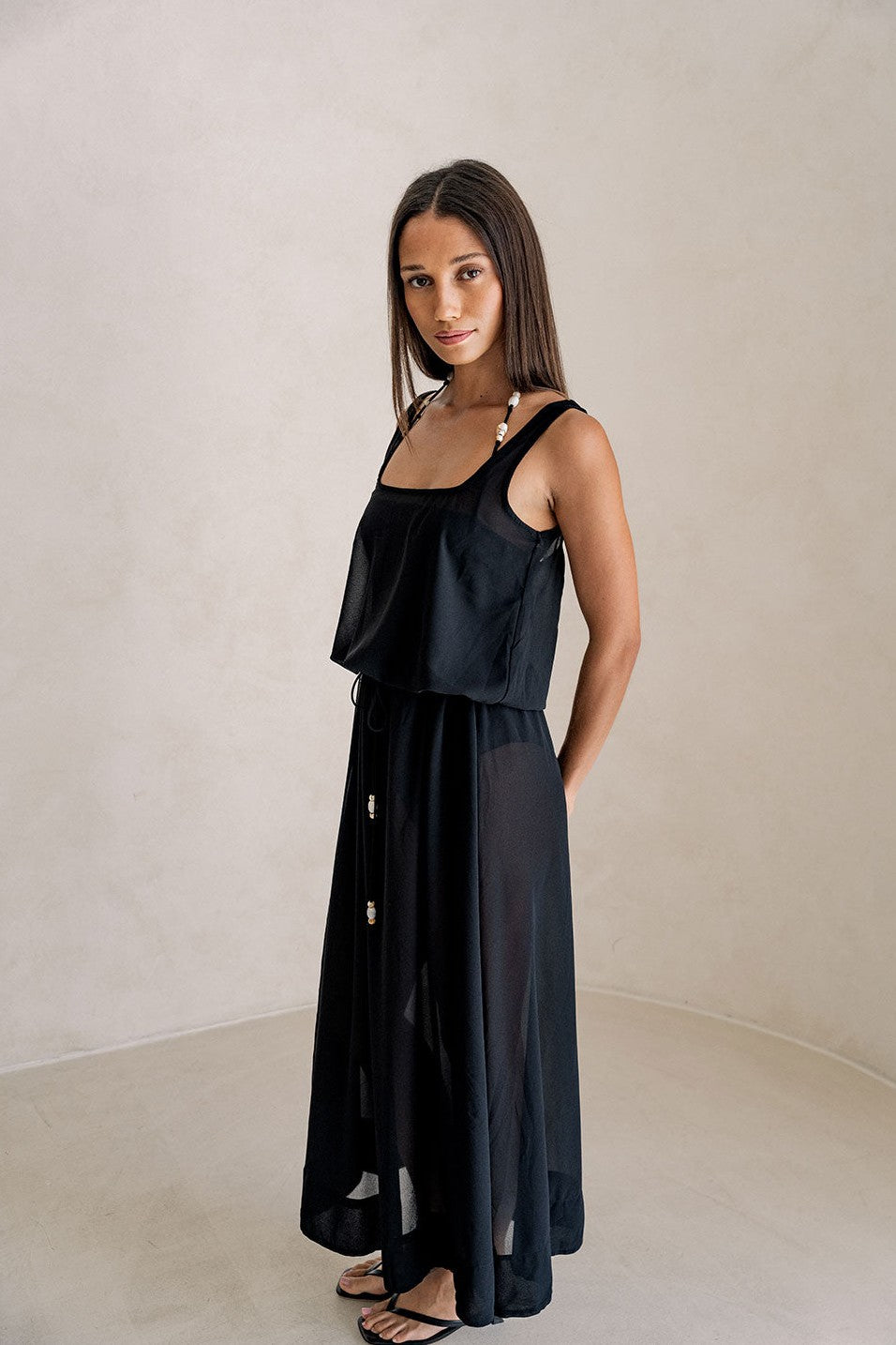 Black maxi dress with a halter neckline, back view