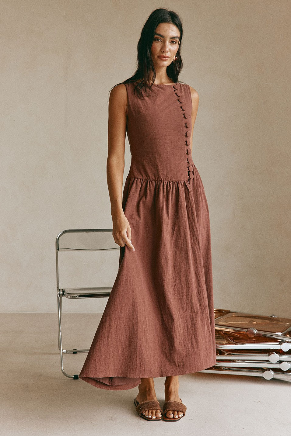 Brown maxi dress with a boat neckline, side view