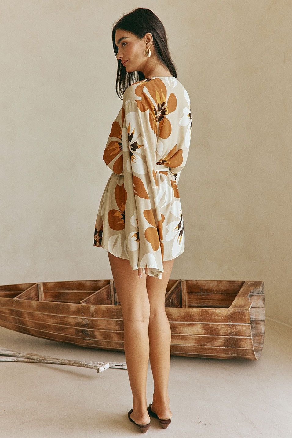 Orange mini dress with a wrap silhouette, front view