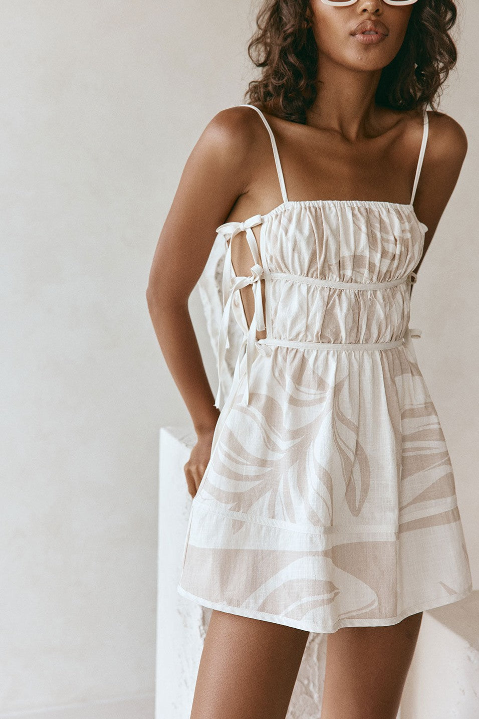 Beige mini dress with a side split, front view