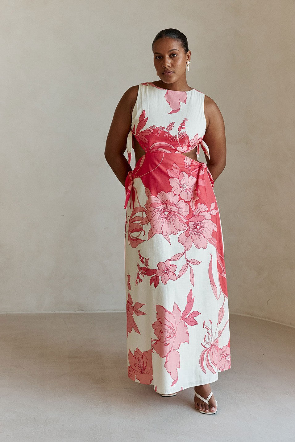 Pink maxi dress with a boat neckline, side view