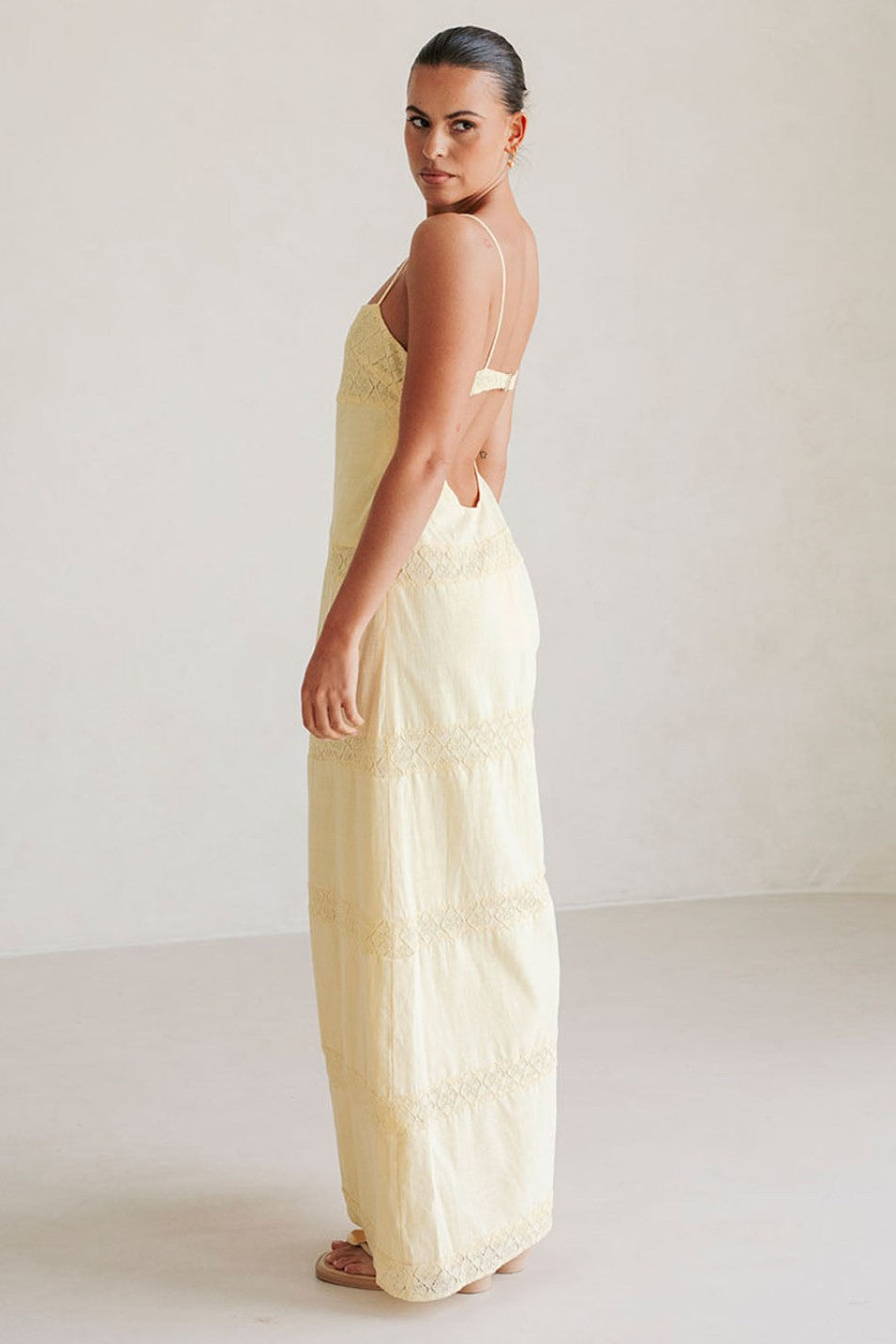 Yellow maxi dress with a round neckline, front view