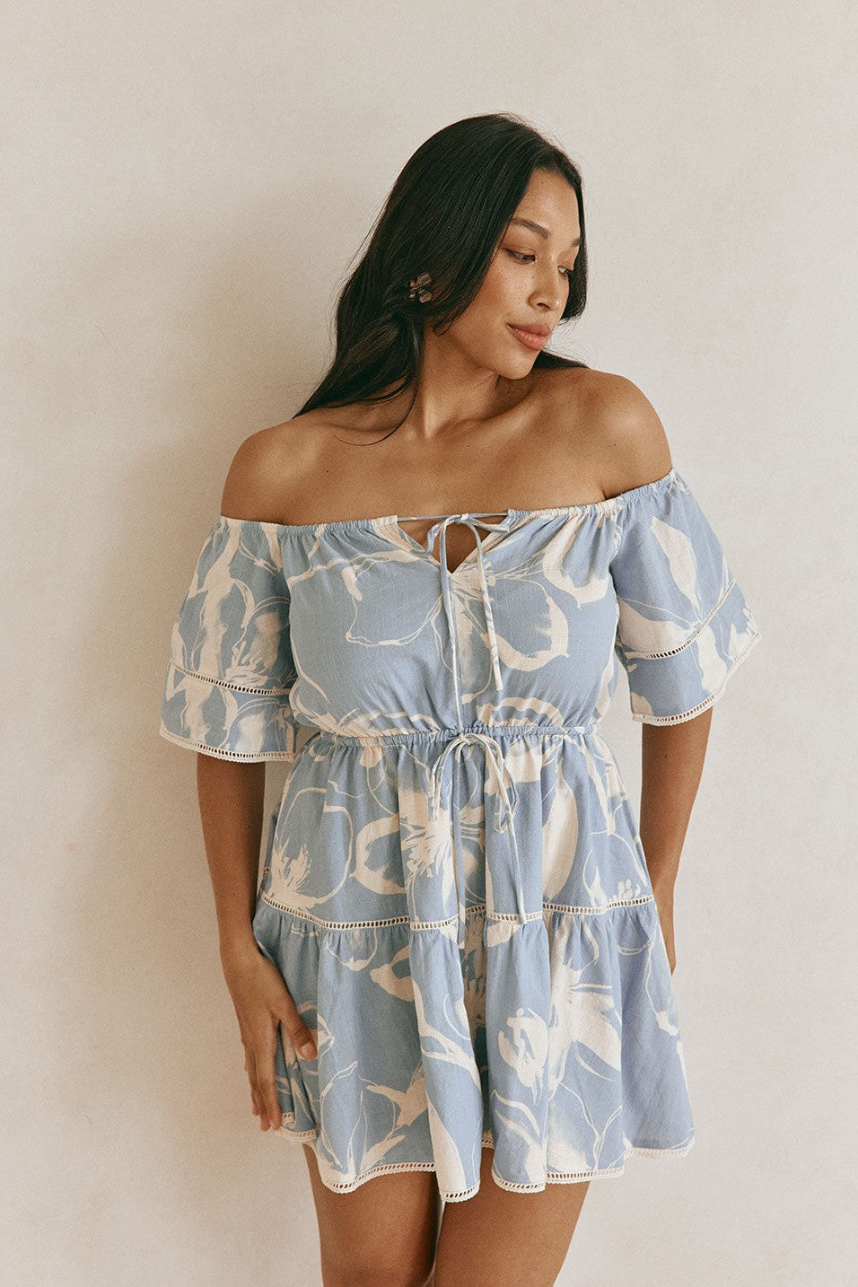 Blue mini dress with a drawstring waist, back view