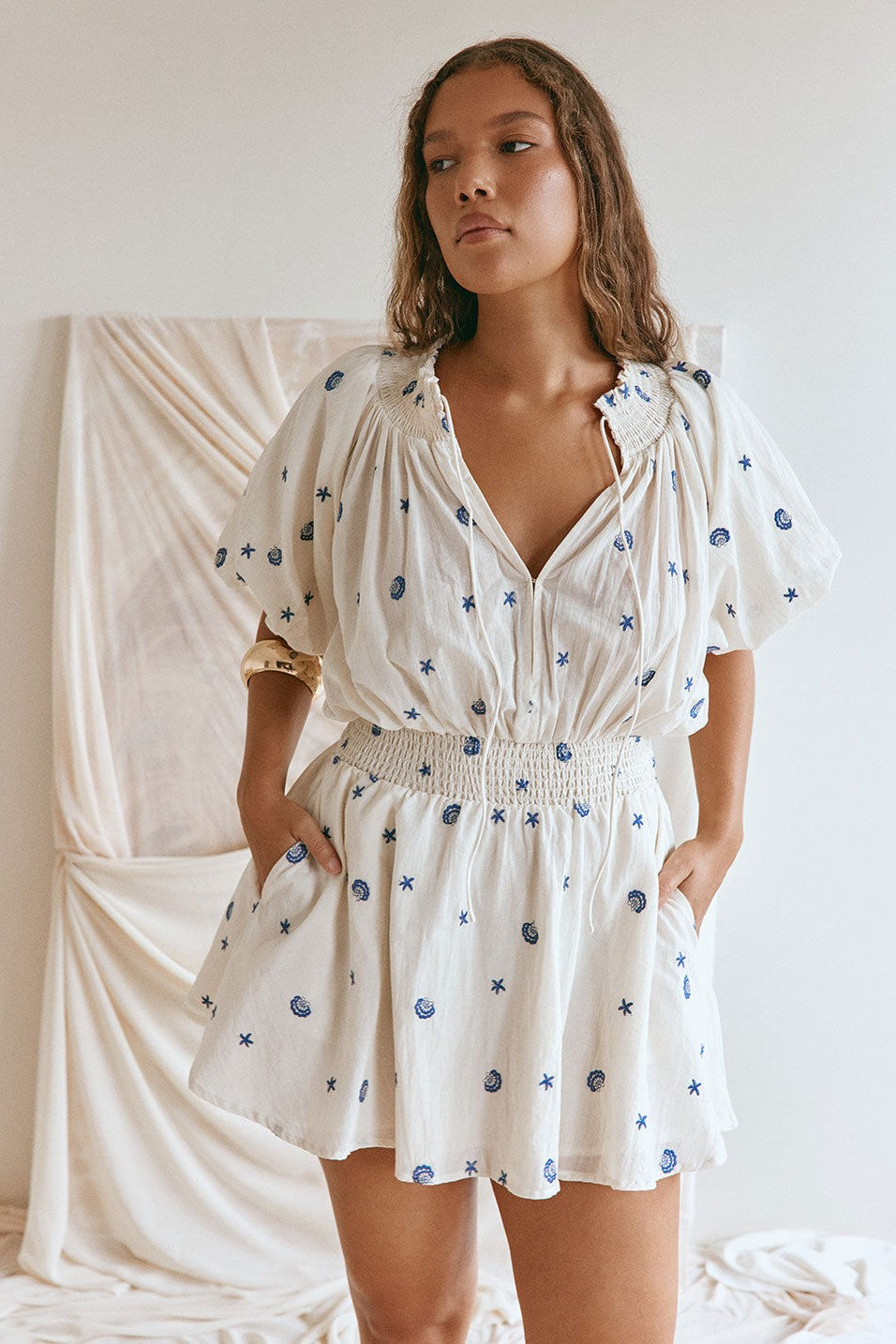 Cream mini dress with shirred detailing, front view