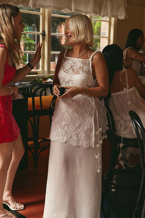 White maxi dress with a halter neckline, front view