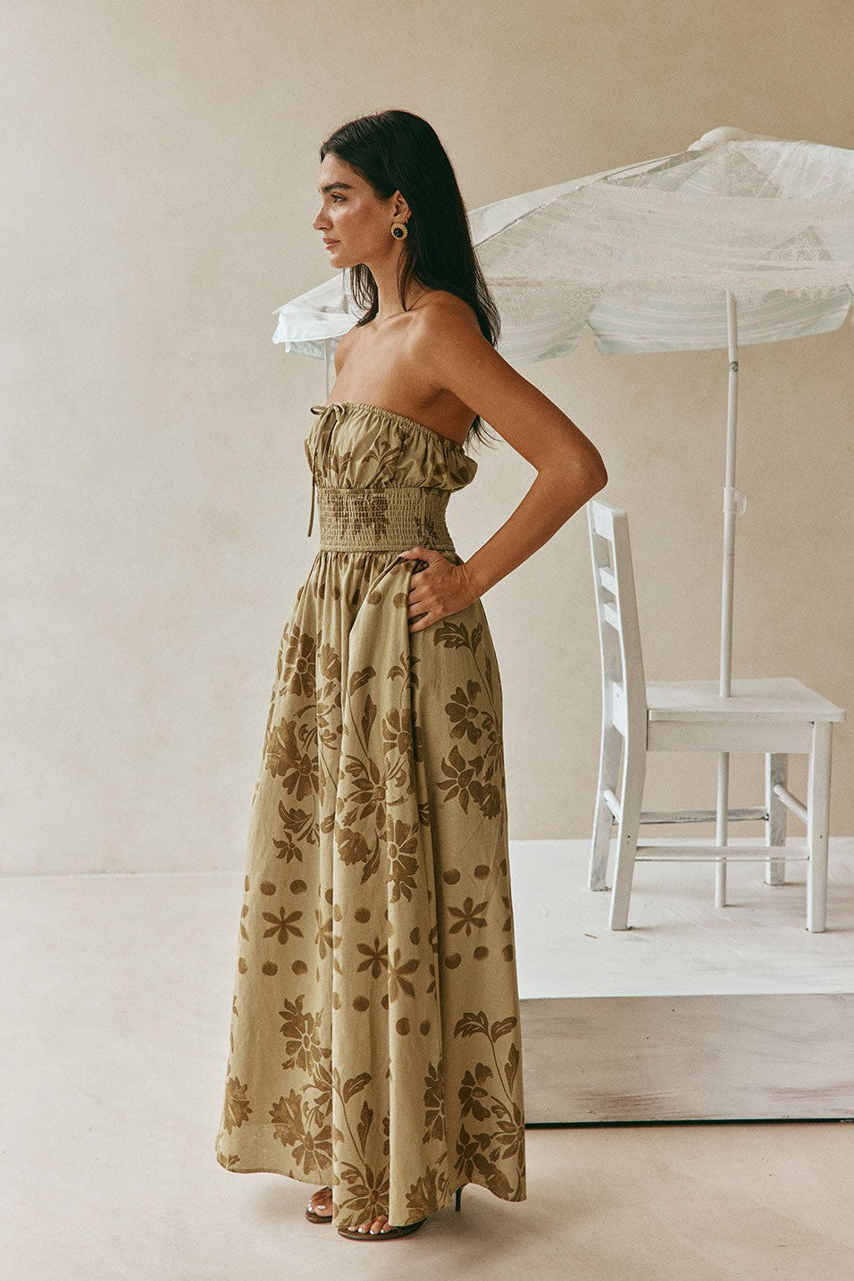 Green maxi dress with a strapless neckline, detail view