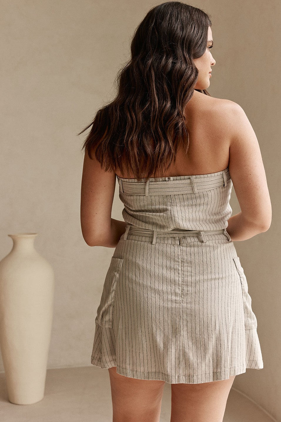 Grey mini dress with a strapless neckline, front view