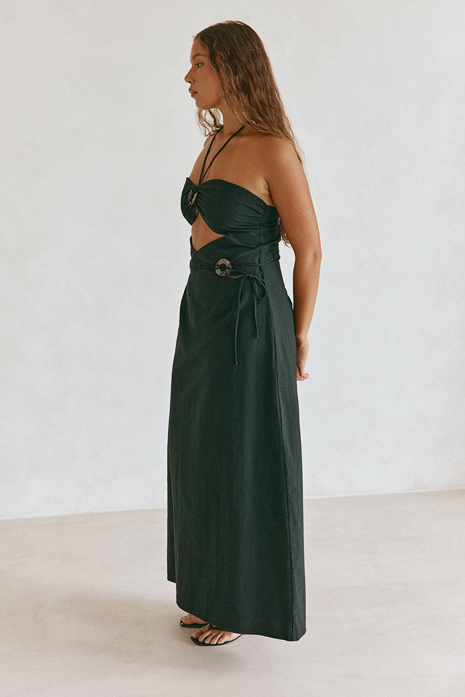 Black maxi dress with a strapless neckline, front view