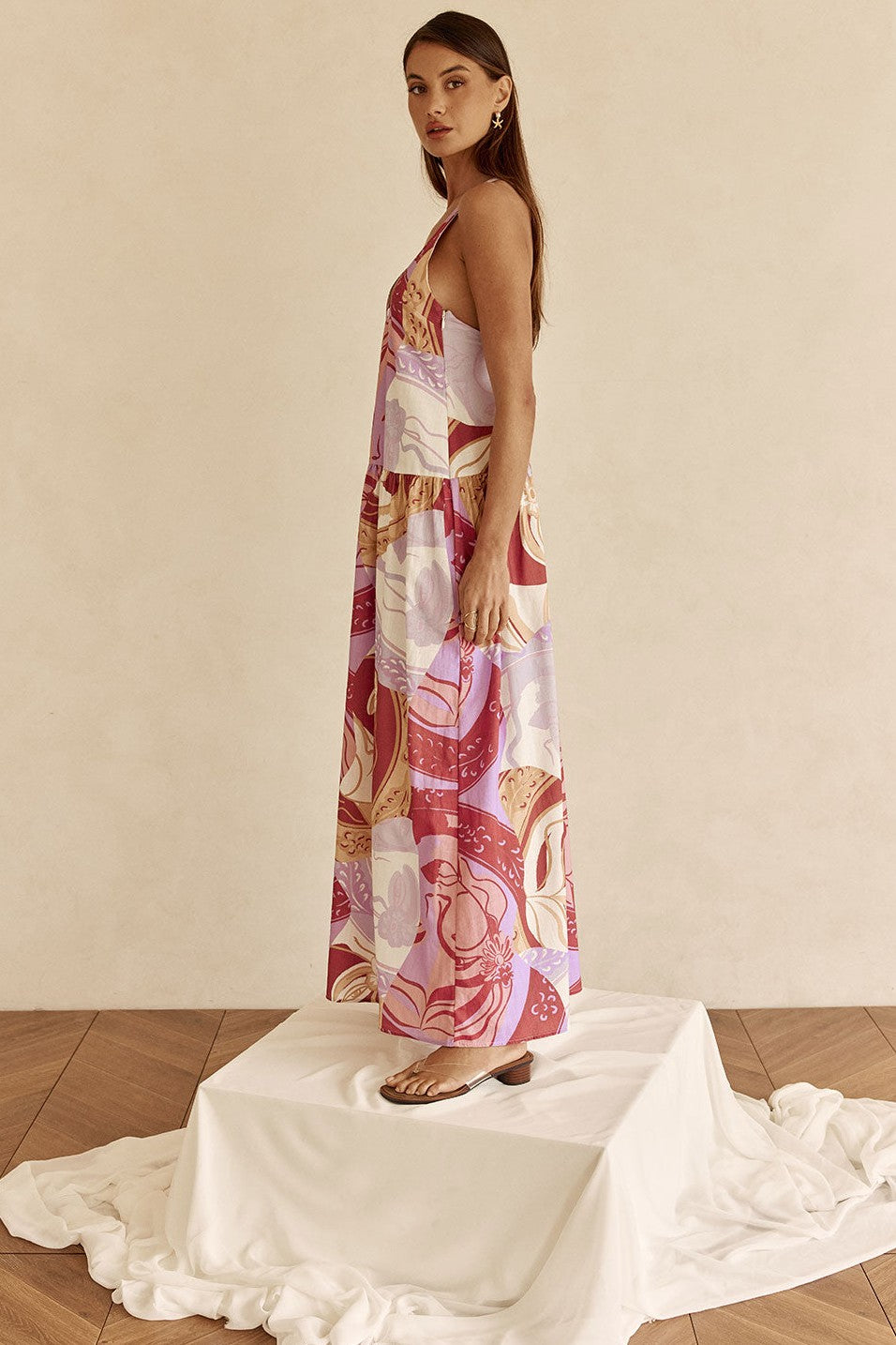 Purple maxi dress with an open back, side view